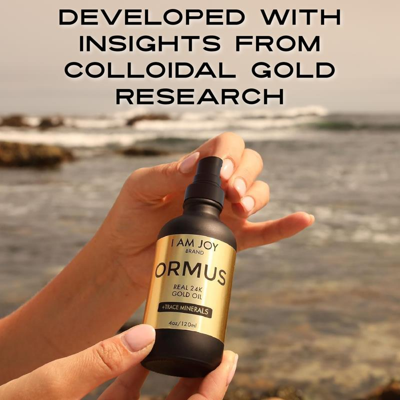 Hand holding Kiro Ormus Gold at ocean